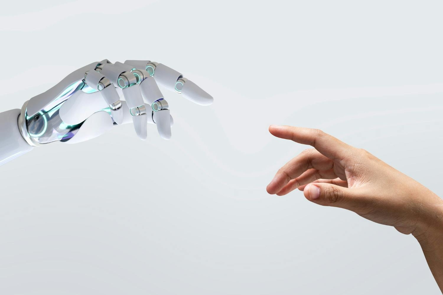 Mano robot y mano humana a punto de tocarse, como en el cuadro de "La creación de Adán", elaborado por Miguel Ángel.